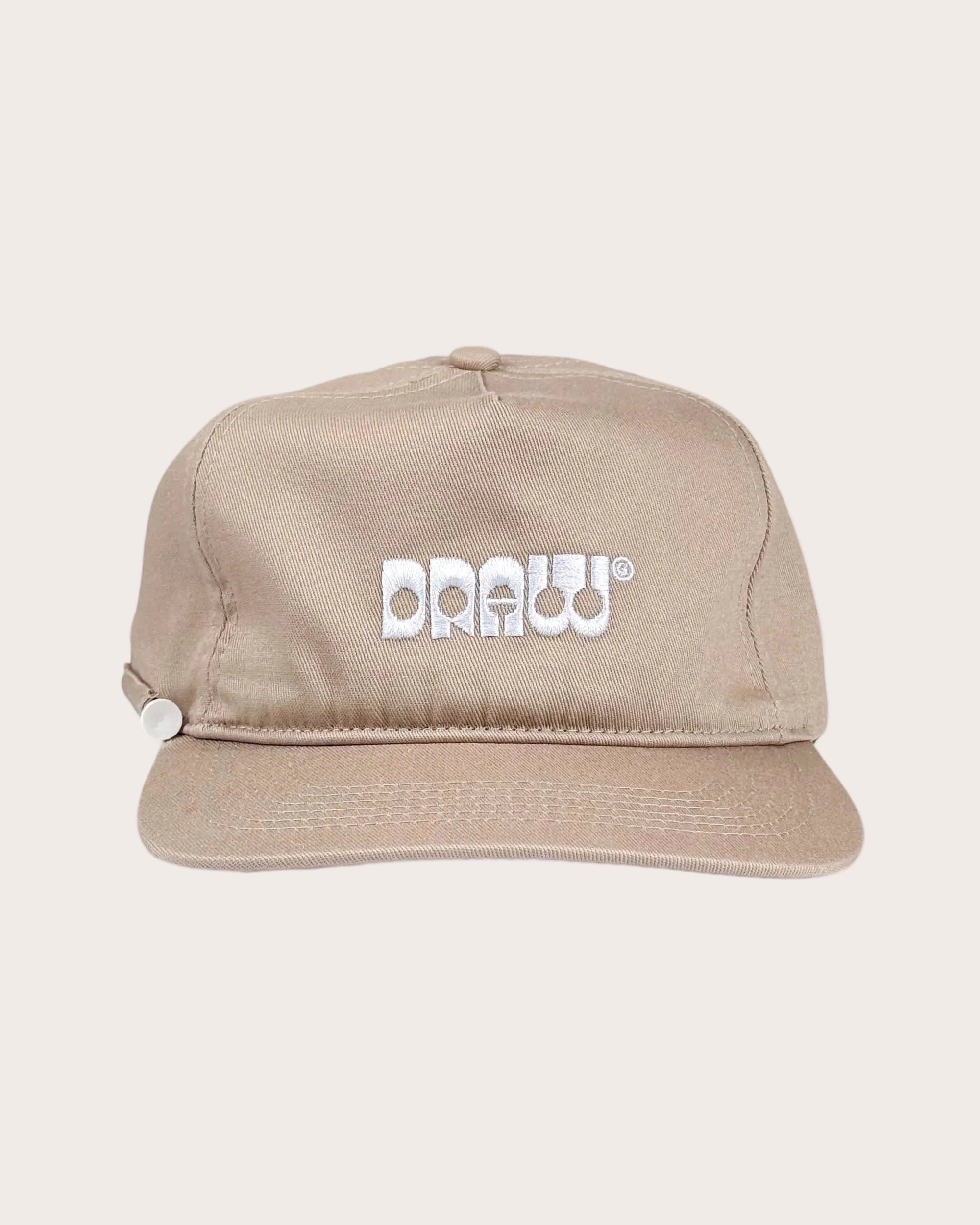 Beige cap with 'DRAWW' logo on a white background