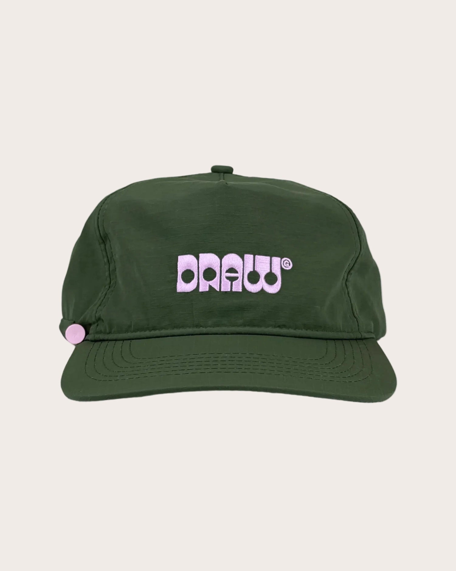 Green cap with 'DRAW' logo on a white background
