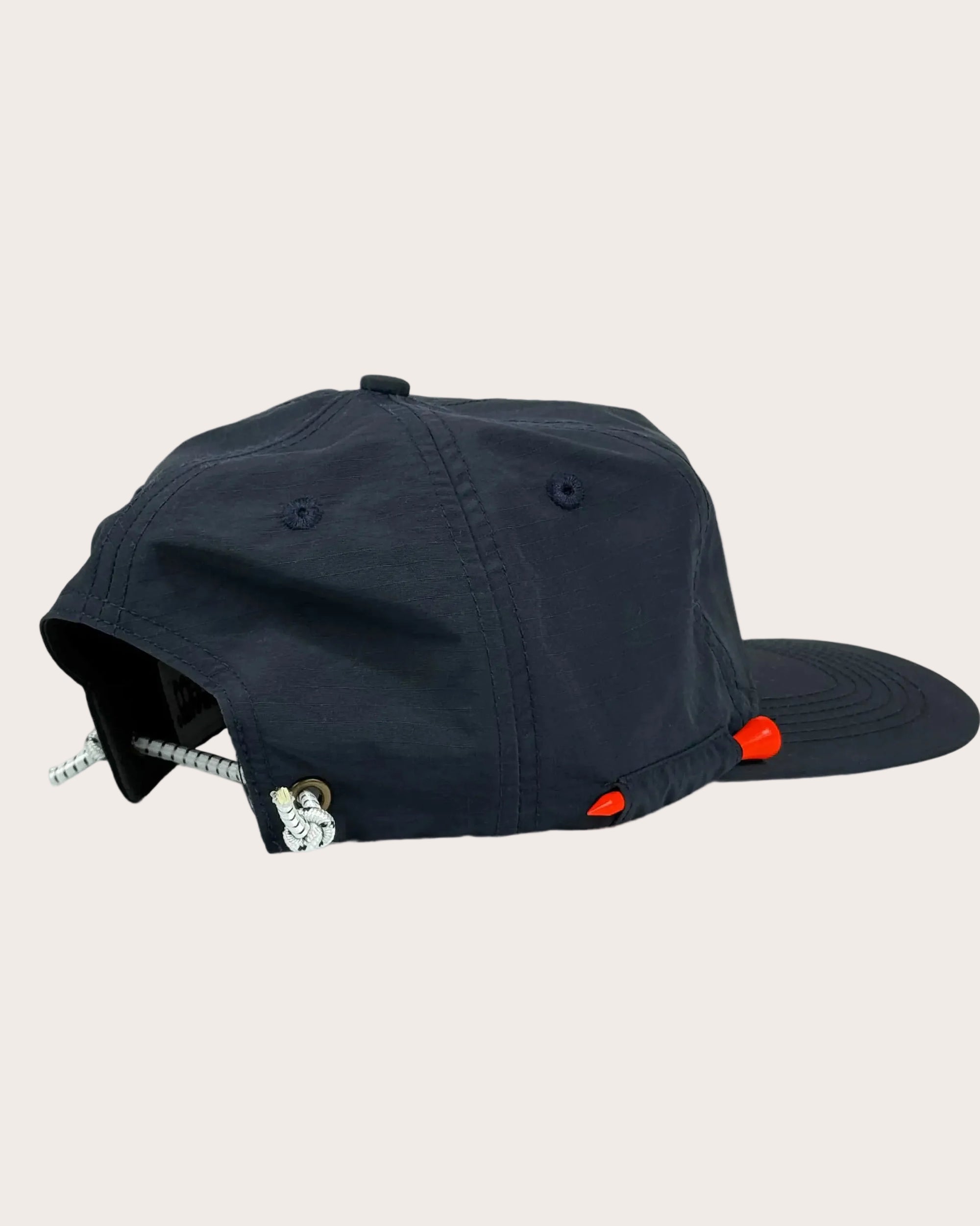 Black cap with red accents on a white background
